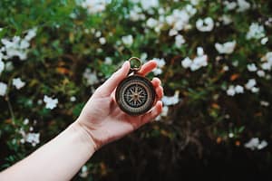 person holding compass ask an advocate